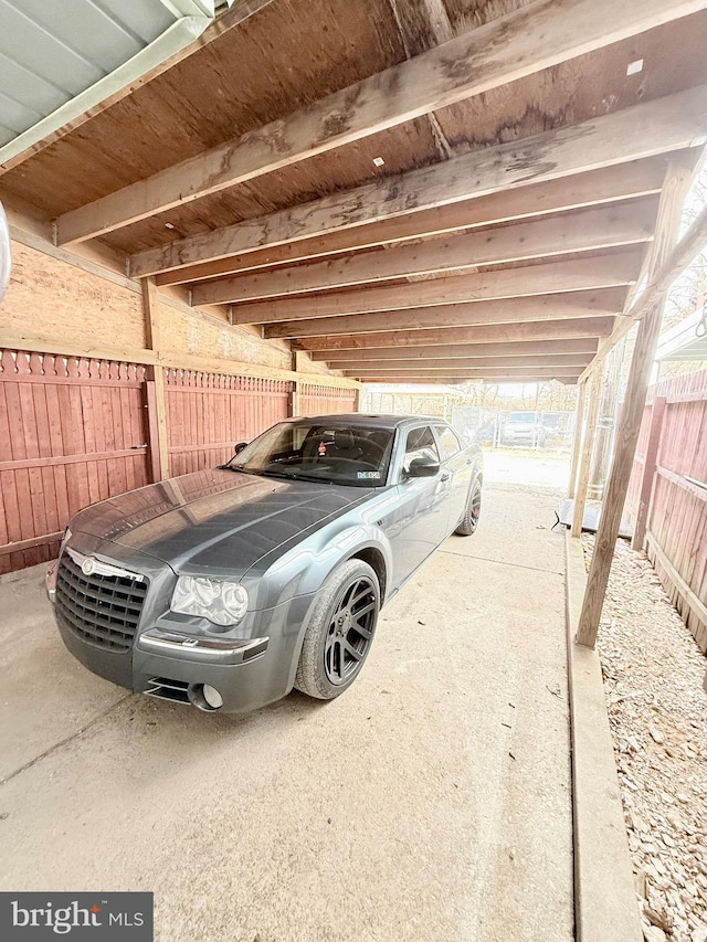 view of vehicle parking featuring a carport