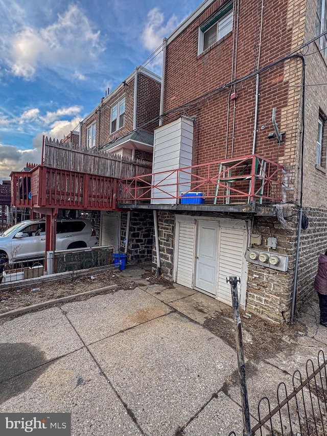 exterior space featuring brick siding