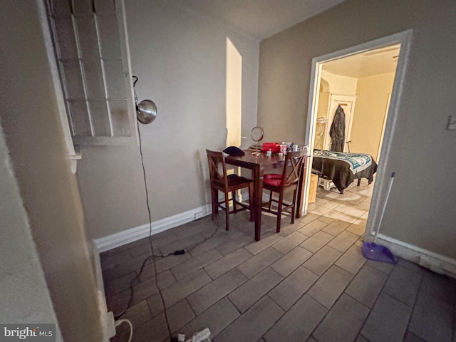 dining room with baseboards