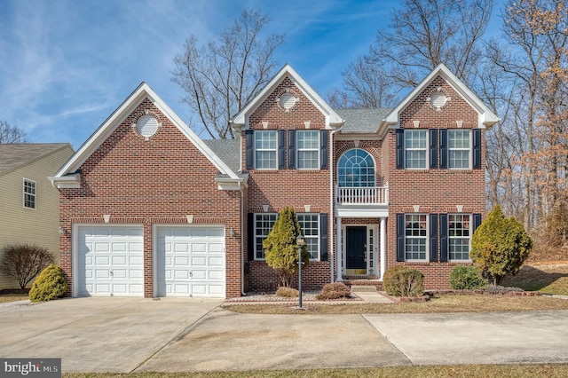 view of front facade with a garage, brick siding, and driveway