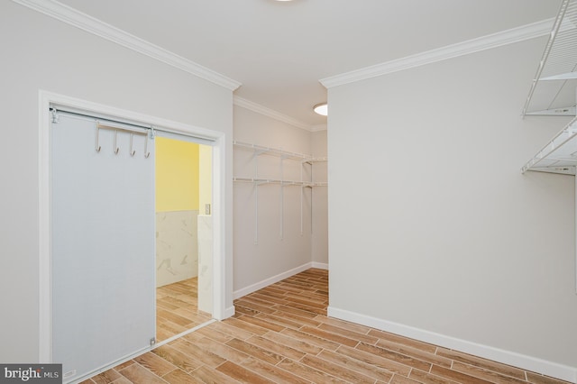 walk in closet with wood tiled floor