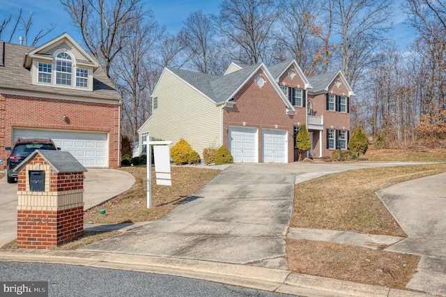 view of front of property featuring brick siding and driveway