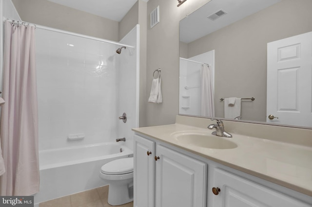 bathroom featuring toilet, visible vents, shower / bath combo with shower curtain, and vanity