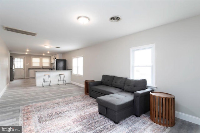 living room with light hardwood / wood-style floors