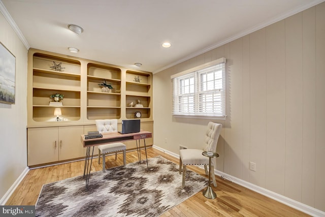 office space with light wood finished floors, baseboards, and ornamental molding