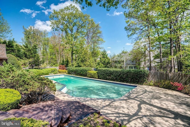 view of pool featuring a patio, fence, and a fenced in pool