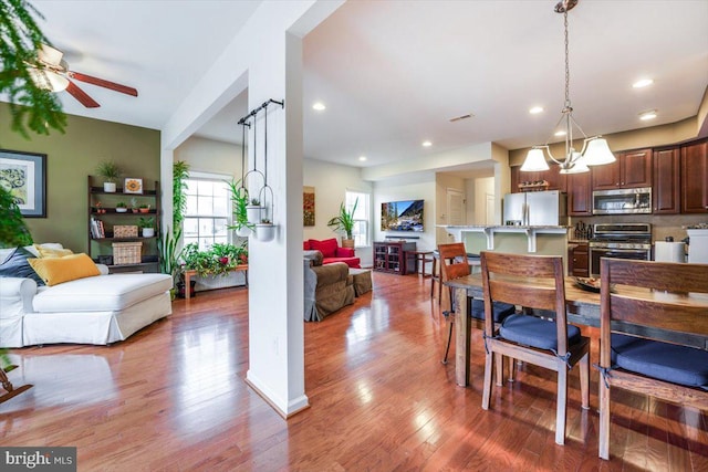 dining room featuring a ceiling fan, recessed lighting, visible vents, and light wood-style floors