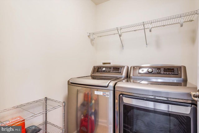 clothes washing area with laundry area and independent washer and dryer