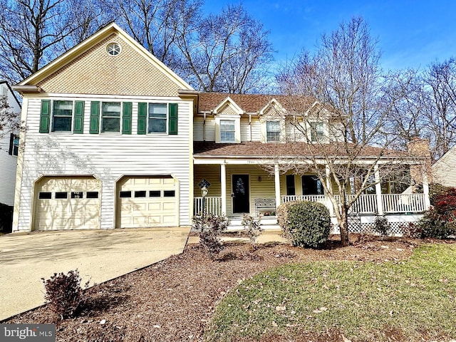 view of front of house featuring covered porch, driveway, and an attached garage