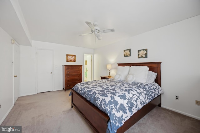 bedroom with ceiling fan and light colored carpet