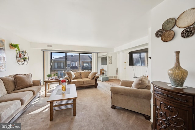 living room featuring light colored carpet