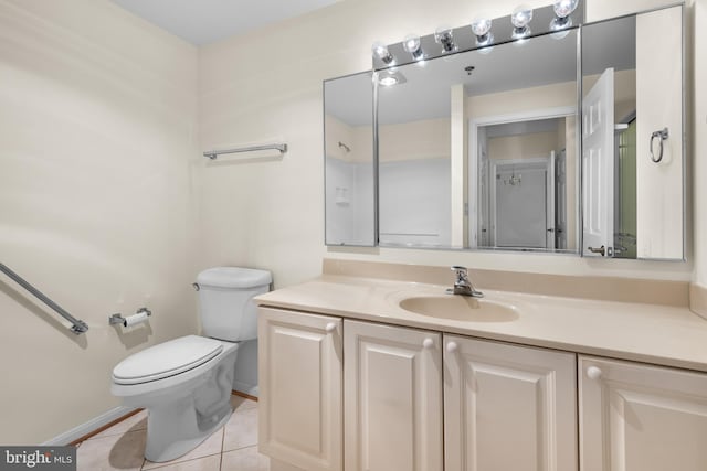 bathroom with toilet, tile patterned flooring, and vanity