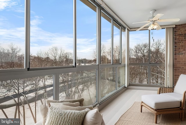 sunroom / solarium with ceiling fan