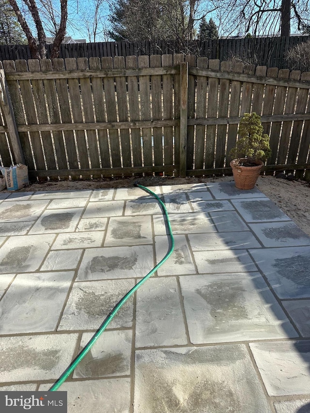 view of patio featuring fence