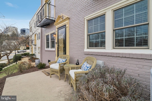 view of patio featuring a balcony