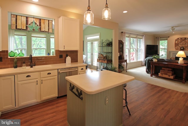 15516 Wigeon Way, Woodbridge, VA 22191 - kitchen with stainless steel dishwasher, a sink, open floor plan, dark wood-style flooring, and decorative backsplash