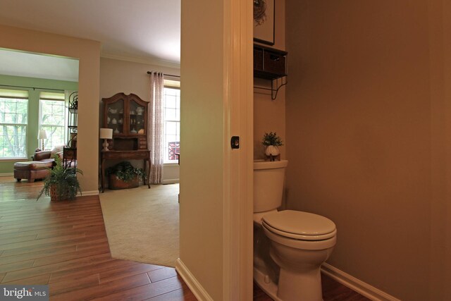 15516 Wigeon Way, Woodbridge, VA 22191 - bathroom featuring plenty of natural light, toilet, wood finished floors, ornamental molding, and baseboards