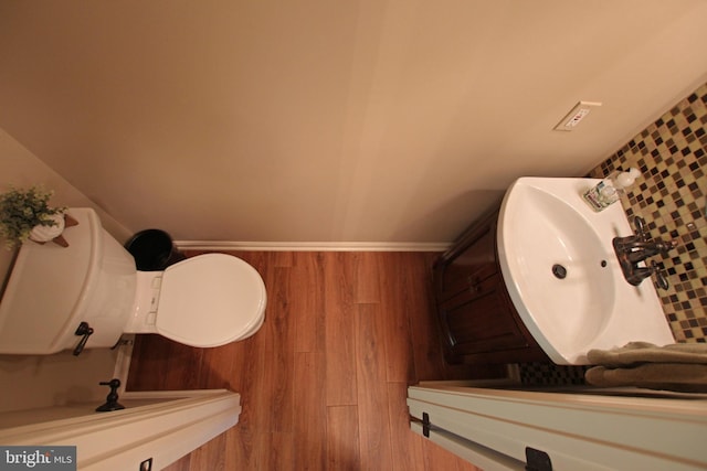 15516 Wigeon Way, Woodbridge, VA 22191 - bathroom with a sink, wood finished floors, baseboards, and toilet