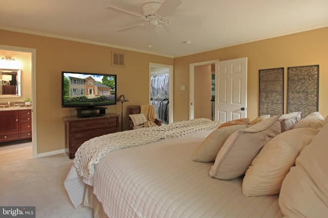 15516 Wigeon Way, Woodbridge, VA 22191 - bedroom with light carpet, ornamental molding, a sink, ensuite bath, and baseboards