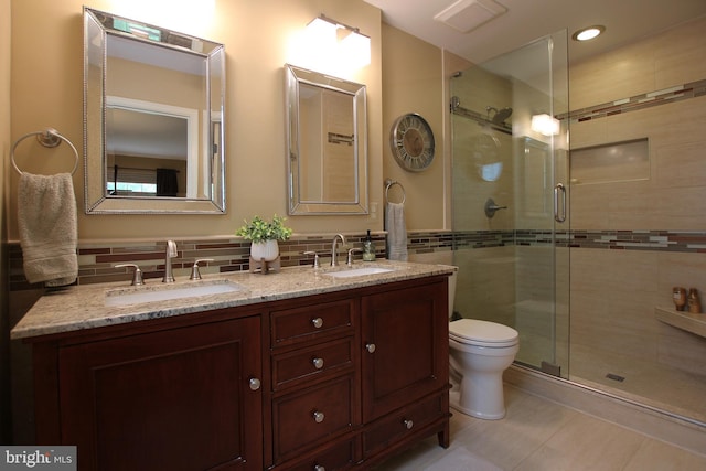 15516 Wigeon Way, Woodbridge, VA 22191 - full bath featuring a stall shower, double vanity, toilet, tile patterned flooring, and tile walls