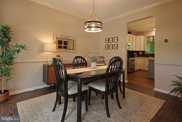 15516 Wigeon Way, Woodbridge, VA 22191 - dining area with a chandelier, dark wood finished floors, baseboards, and crown molding