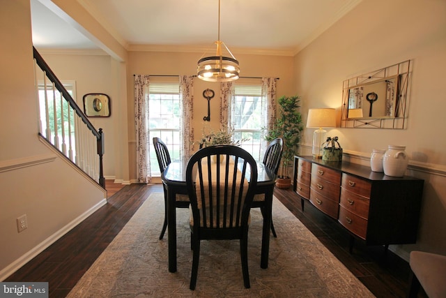 15516 Wigeon Way, Woodbridge, VA 22191 - dining space featuring stairs, dark wood-type flooring, crown molding, a chandelier, and baseboards