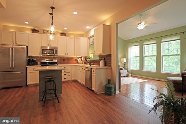 15516 Wigeon Way, Woodbridge, VA 22191 - kitchen featuring stainless steel appliances, light countertops, a ceiling fan, and dark wood-type flooring