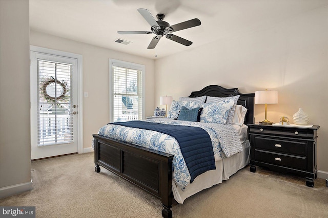 bedroom featuring light carpet, baseboards, visible vents, and access to exterior