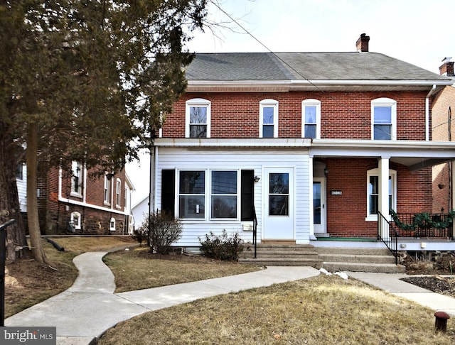 28 N 2nd St, Souderton, PA 18964 - view of front of home with covered porch and a front yard