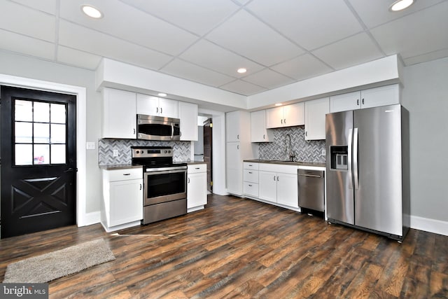 28 N 2nd St, Souderton, PA 18964 - kitchen featuring stainless steel appliances, dark hardwood / wood-style flooring, sink, backsplash, and white cabinets