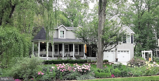 view of front of house with a garage and a porch