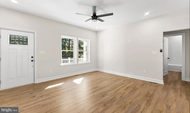 entryway with ceiling fan and light hardwood / wood-style flooring