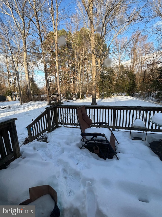 view of snow covered deck