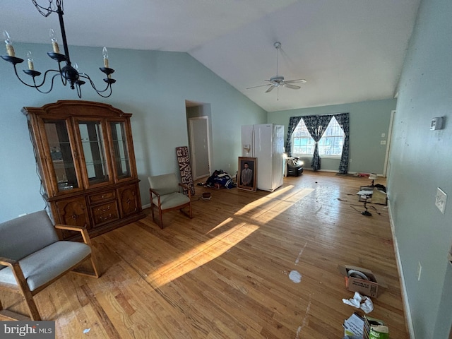 sitting room with ceiling fan, light wood-type flooring, and lofted ceiling