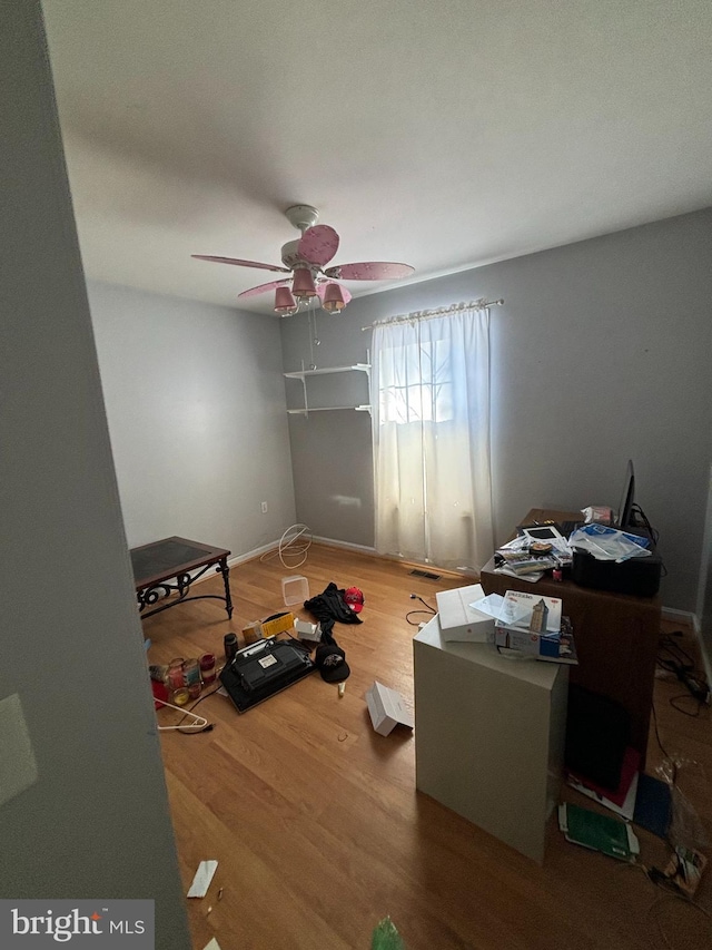 bedroom with hardwood / wood-style floors and ceiling fan