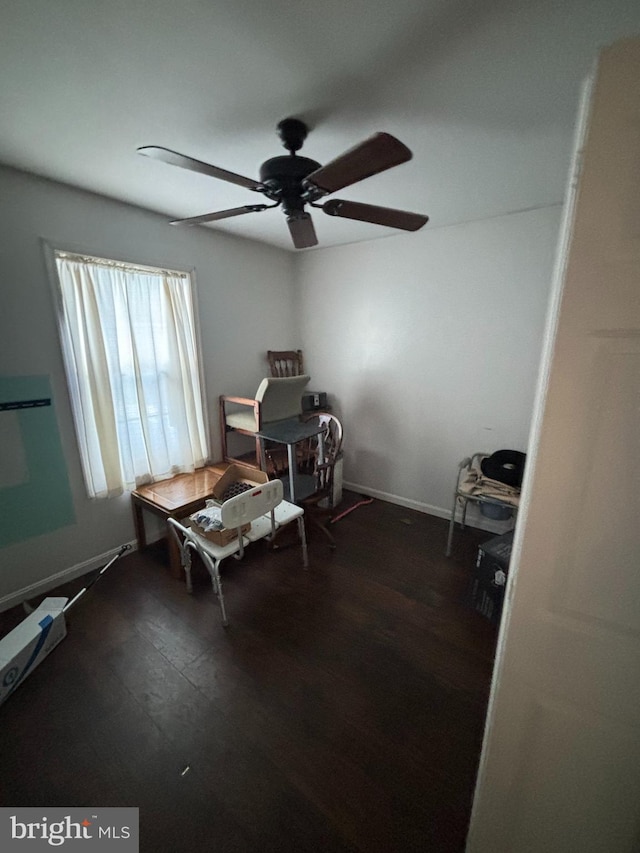 misc room with ceiling fan and dark hardwood / wood-style floors