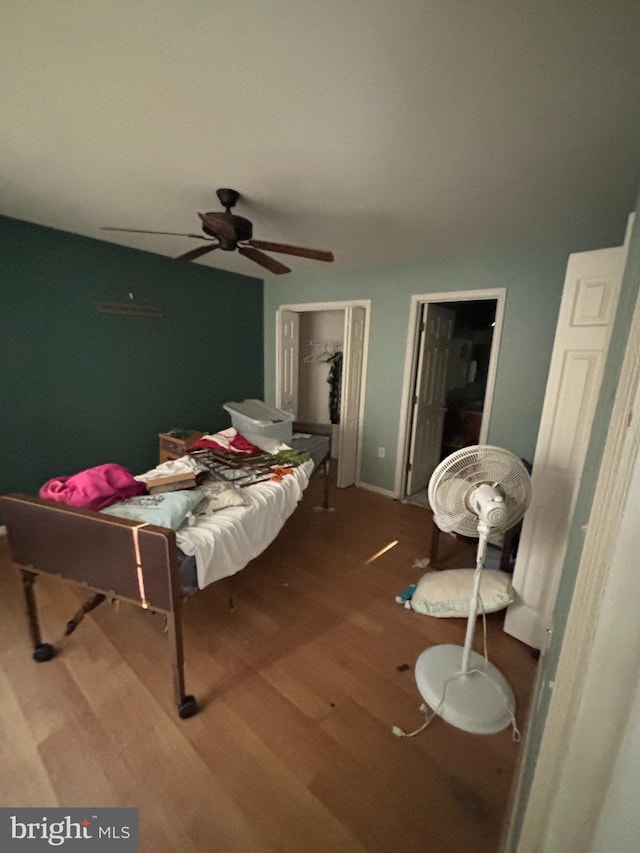 bedroom with hardwood / wood-style flooring and ceiling fan