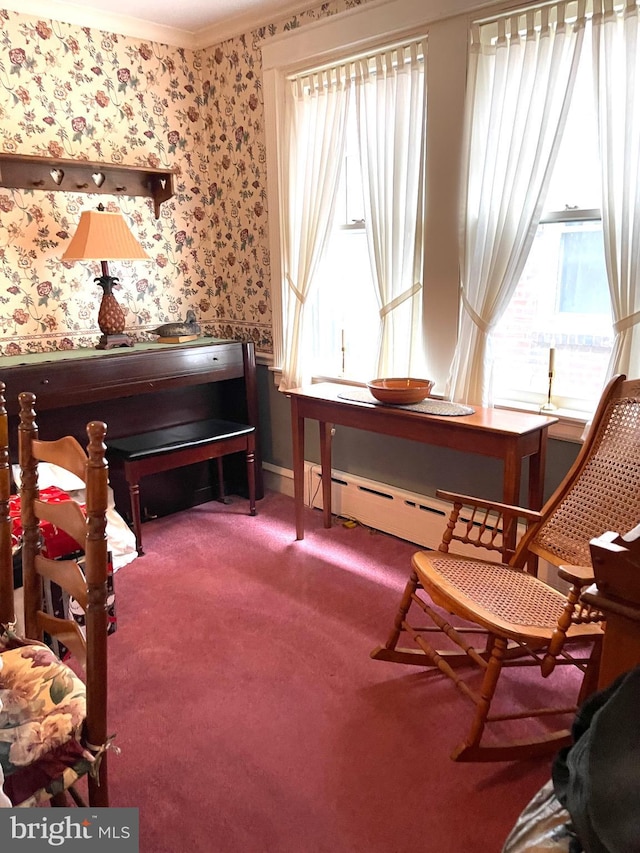 sitting room featuring carpet floors and ornamental molding