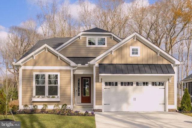 view of front facade with a front yard and a garage