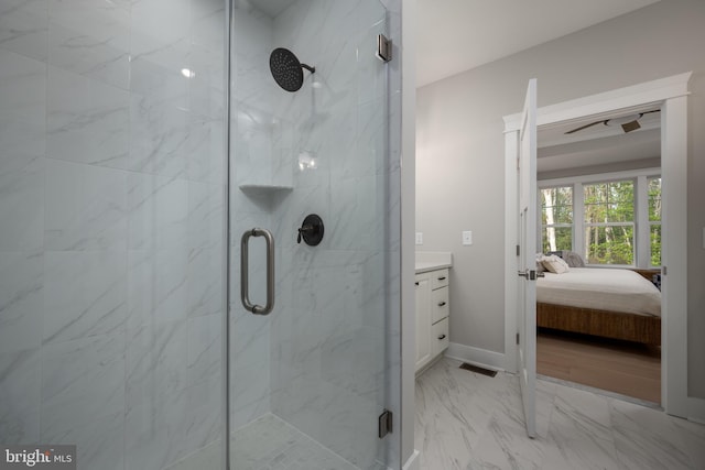 bathroom with an enclosed shower and vanity