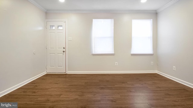 interior space with baseboards, dark wood-type flooring, recessed lighting, and ornamental molding