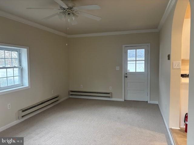 interior space with light carpet, a baseboard heating unit, a ceiling fan, and ornamental molding