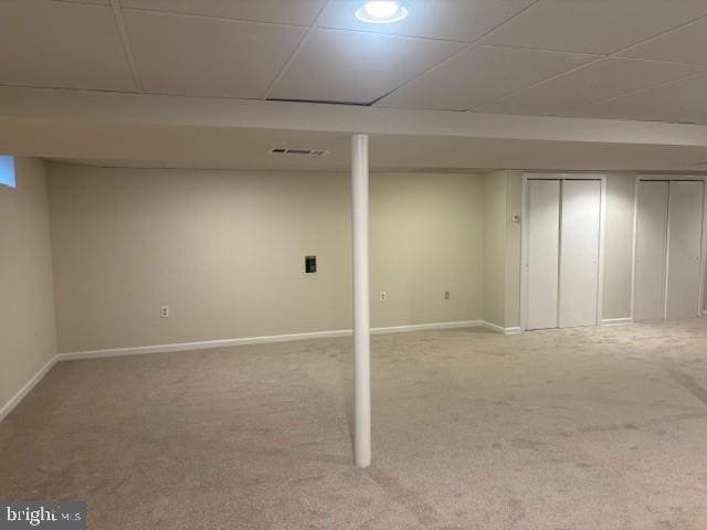 finished below grade area featuring carpet floors and baseboards