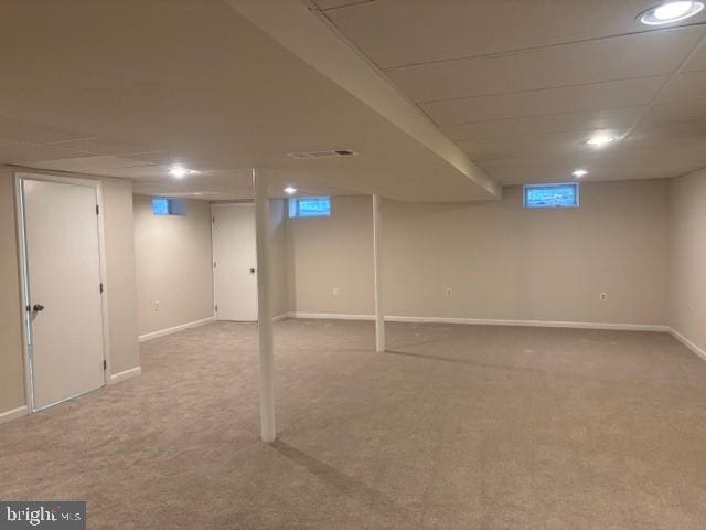 finished basement with carpet floors, recessed lighting, and baseboards