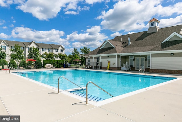 view of swimming pool with a patio area