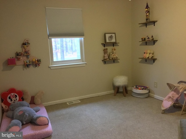 game room with carpet floors, baseboards, and visible vents