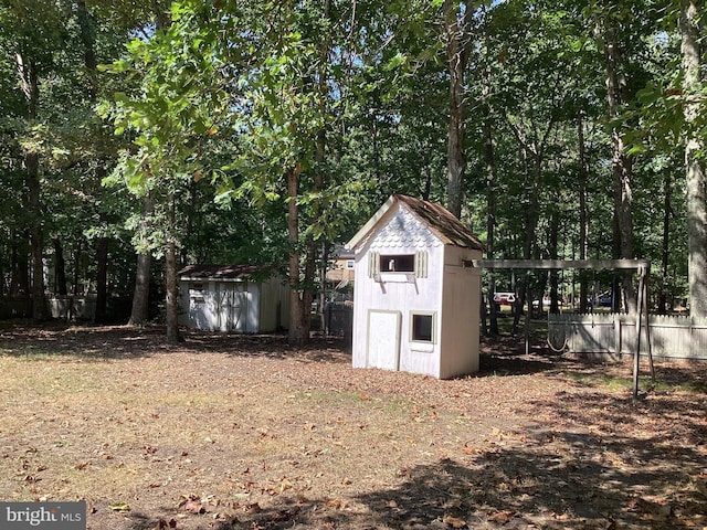 view of shed with fence