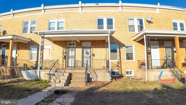 exterior space with brick siding