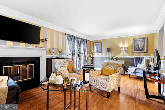 living room featuring hardwood / wood-style flooring and crown molding