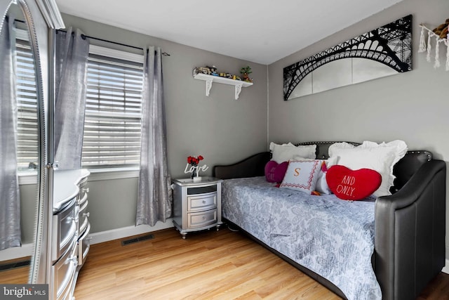 bedroom featuring wood-type flooring